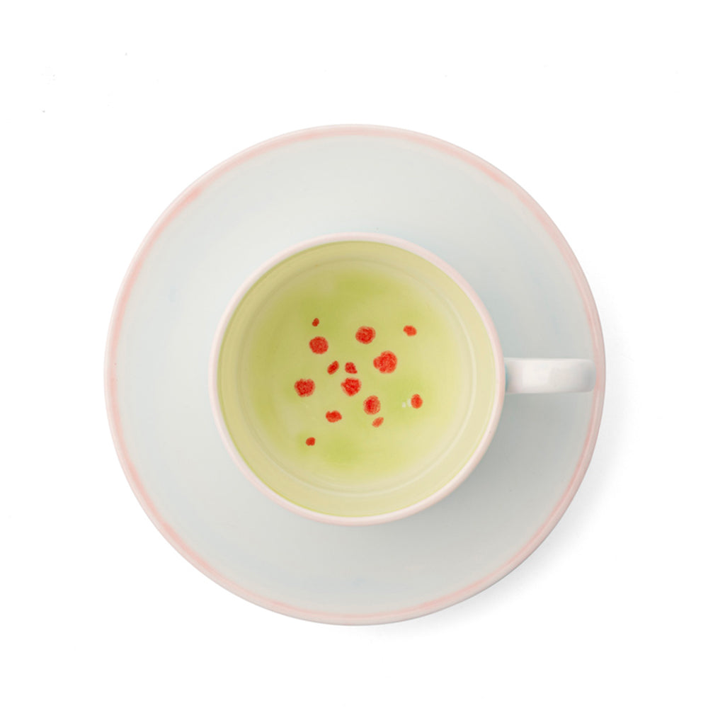 Dot-decorated cup and saucer